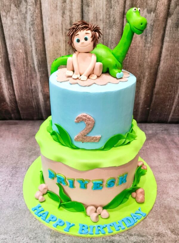 Baby with Dino cake
